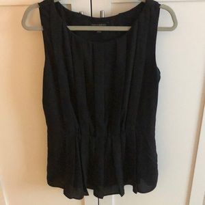 Pleated black sleeveless blouse